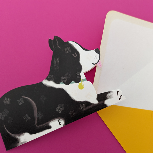 Carte de voeux découpée en forme de chien couché. À l'intérieur vous pouvez écrire votre message. Cette carte adorable apportera beaucoup de joie à votre destinataire.
