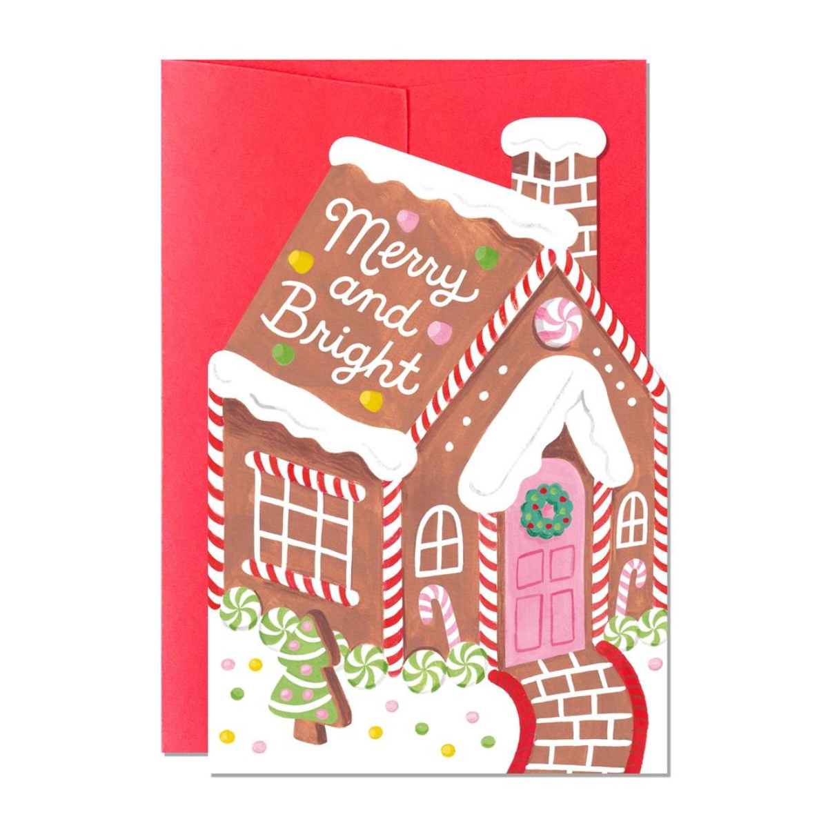 Cette charmante carte en forme de maison en pain d'épices évoque les douceurs de Noël.