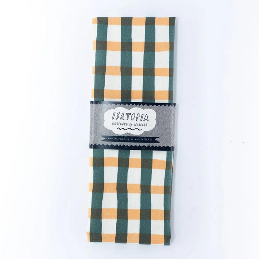 Le torchon Pique-Nique Peach & Forest d'Isatopia est une excellente option pour ajouter une touche artistique et fonctionnelle à votre espace culinaire.