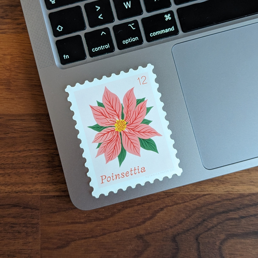 Ce sticker façon timbre poste est orné d'une magnifique Poinsettia, la fleur emblématique de la saison des fêtes. Elle évoque la beauté et l'élégance de Noël.