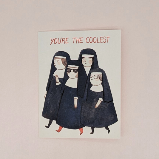 La carte met en scène un groupe de religieuses austères. Parmi elles, une nonne se démarque en arborant des lunettes de soleil, des bas rouges et un grand sourire. En haut de la carte on peut lire " You're The Coolest ". Vous pouvez écrire votre message à l'intérieur de la carte.