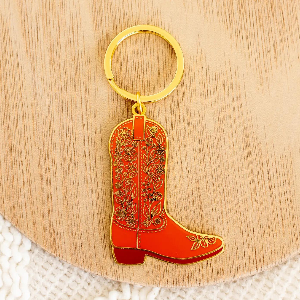Le porte-clés Botte de Cowboy Fleurie est un symbole intemporel du style western.