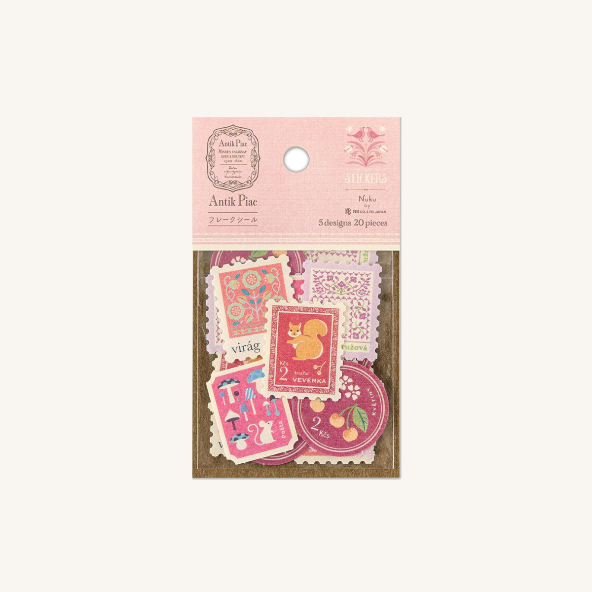 Stickers japonais en forme de timbre de couleur rose.
